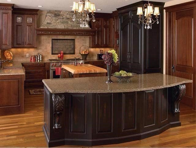 A kitchen with a large island in the middle