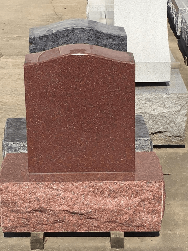 A row of gravestones are lined up in a cemetery