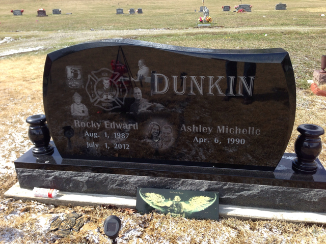 A black gravestone with the name dunkin on it