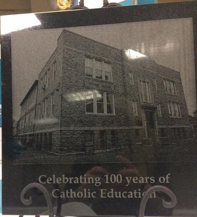 A plaque celebrating 100 years of catholic education