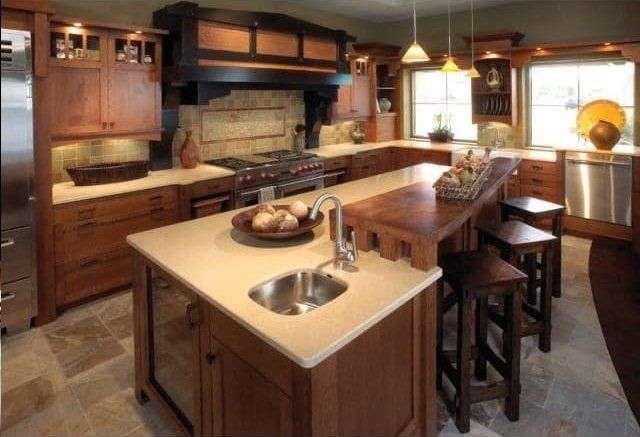 A kitchen with wooden cabinets and stainless steel appliances