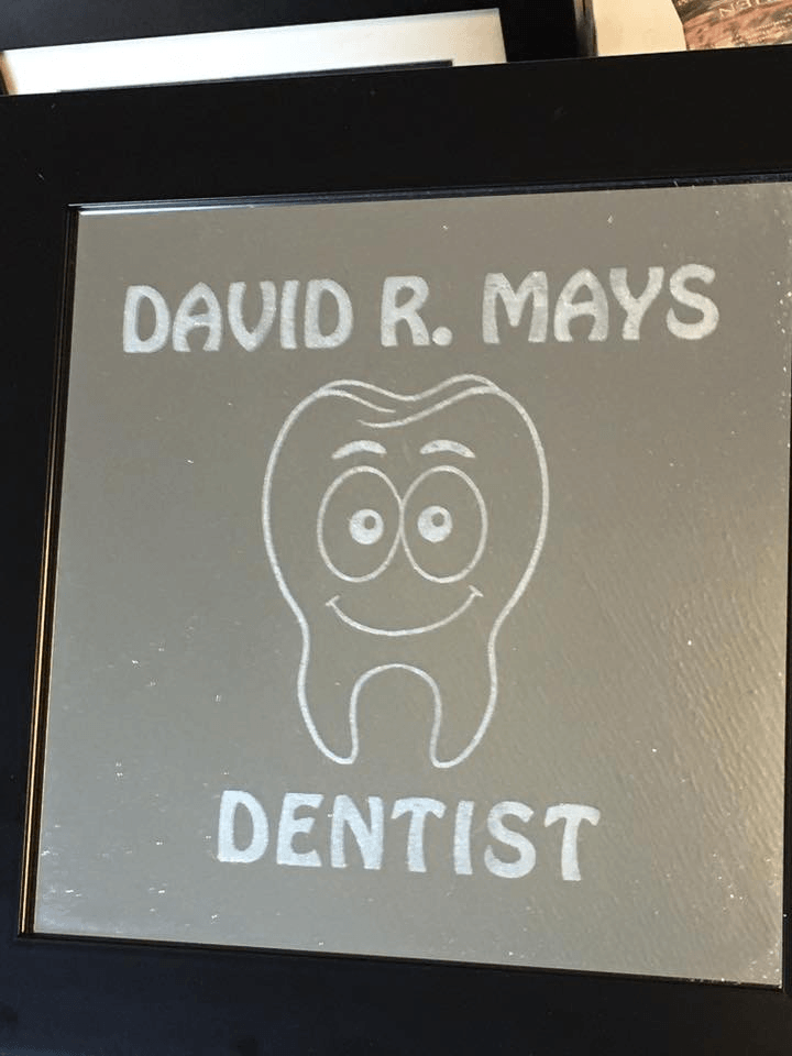 A picture of a tooth with the name david r. mays on it