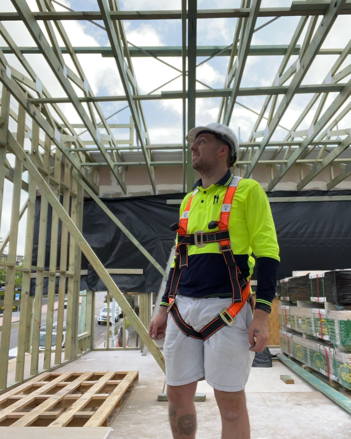 Construction Worker Wearing Safety Harness and Hard Hat — Hunter Fire & Safety in Edgeworth, NSW