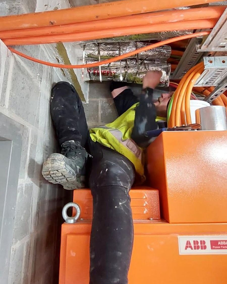 Electrician Working on Wiring, Inside a Room — Hunter Fire & Safety in Edgeworth, NSW
