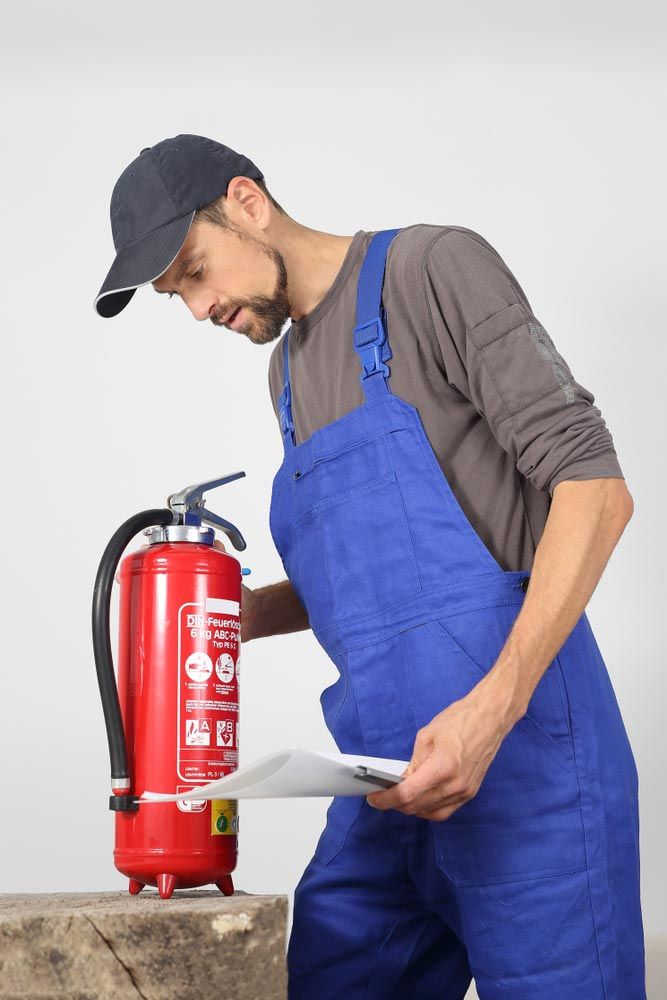 A Fire Extinguisher Check By A Professional — Hunter Fire & Safety in Port Stephens, NSW