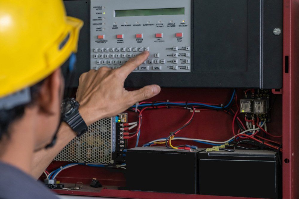 Technician Checking Doing Work Maintenance — Hunter Fire & Safety in Newcastle, NSW