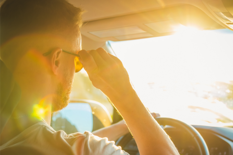 Wearing sunglass during sunny day while driving