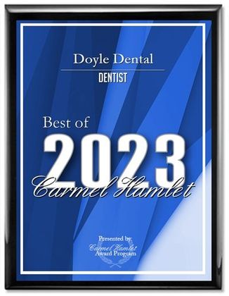 Framed blue plaque reading “Doyle Dental” and “Best of 2023 Carmel Hamlet”