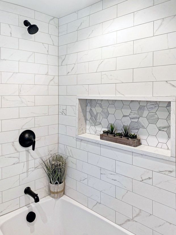 Spotless bathroom tile wall after tile and grout cleaning and sealing service