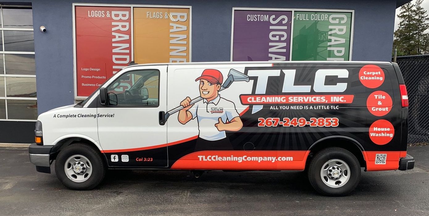 TLC Cleaning Services branded van with carpet cleaning and house washing service info