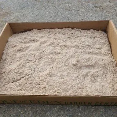 Cardboard box filled with fine white powder or flour