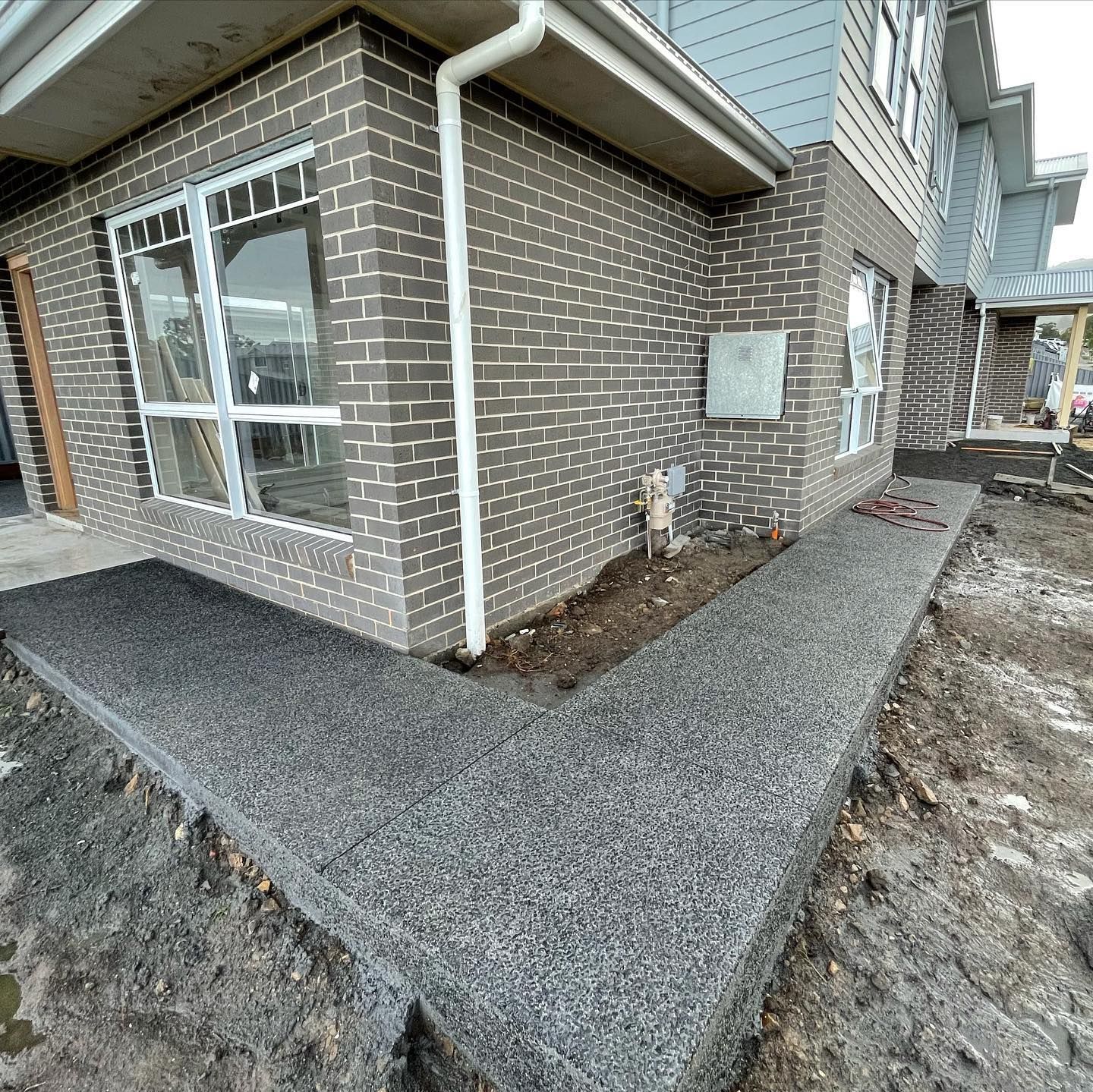 A Newly Poured Exposed Aggregate Concrete Path — JDB Concreting in Horsley, NSW