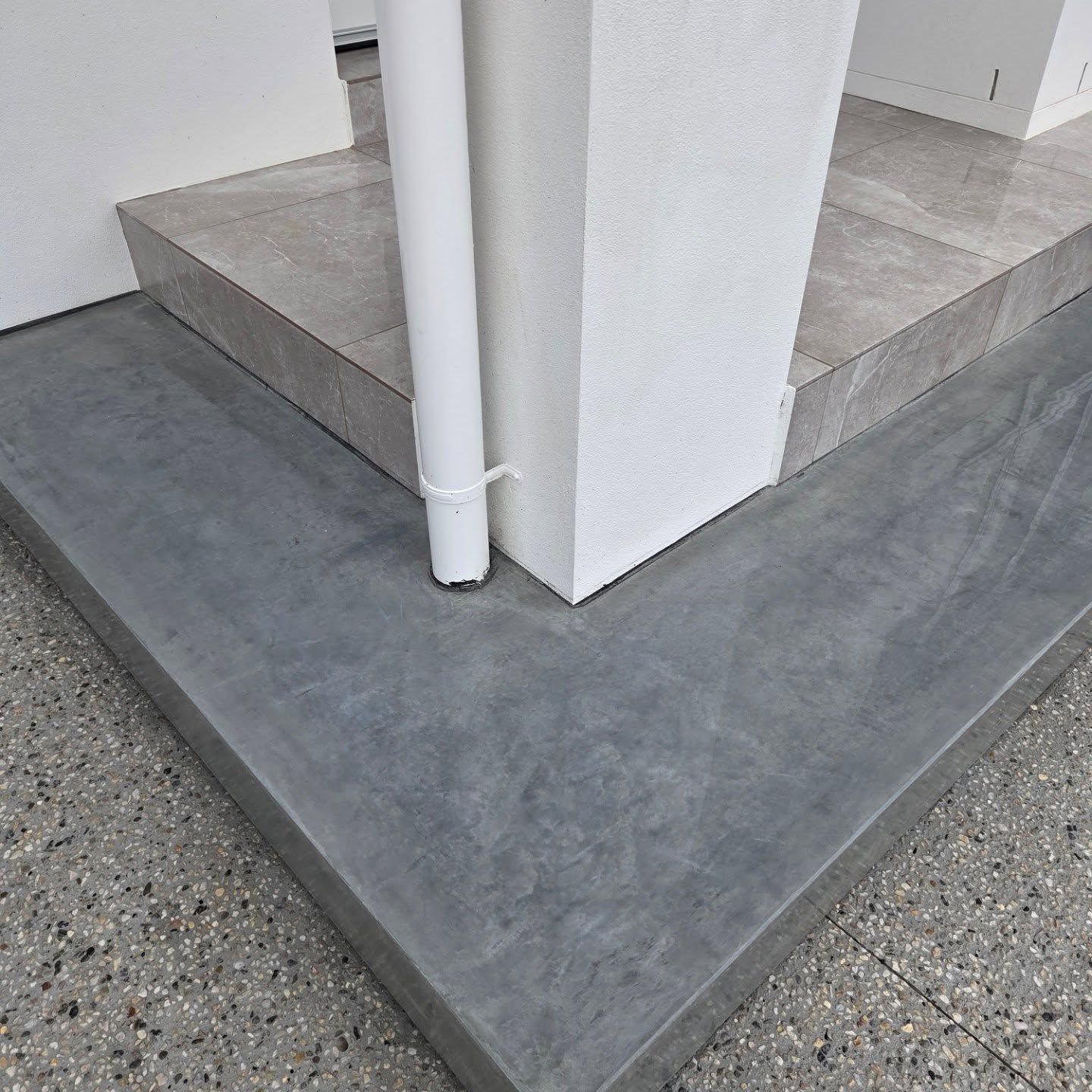 Close-up of a White Corner Column on a Tiled Porch Step — JDB Concreting in Wollongong, NSW