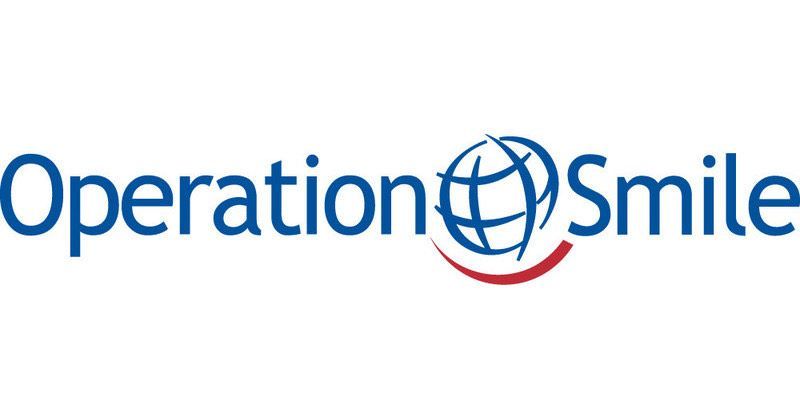 The logo for operation smile has a globe and a smile on it.