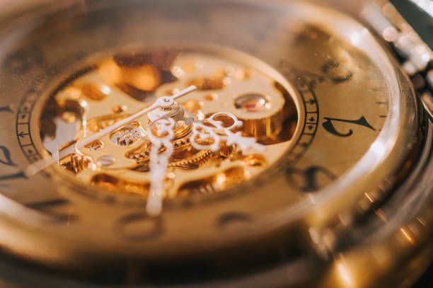 A close up of the inside of a gold watch.