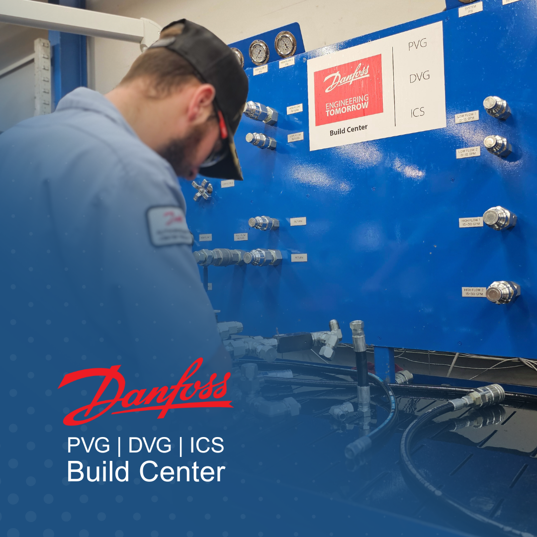 A man is working on a machine in a danfoss build center