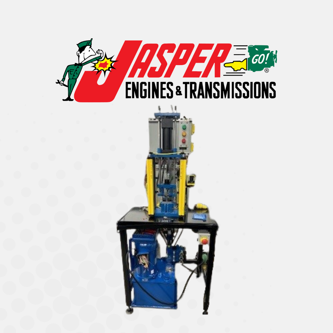 A jasper engines and transmissions logo with a machine on a table