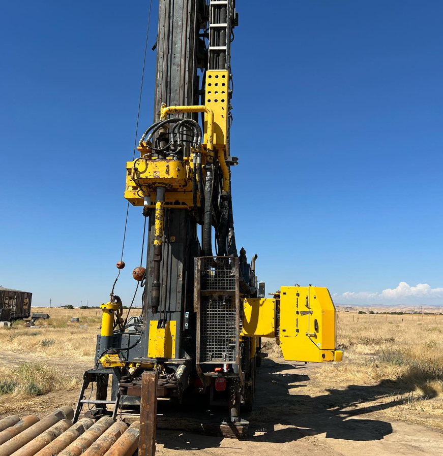 A truck is being used to drill a hole in the ground.