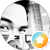 Orange circle with a white letter “K” icon