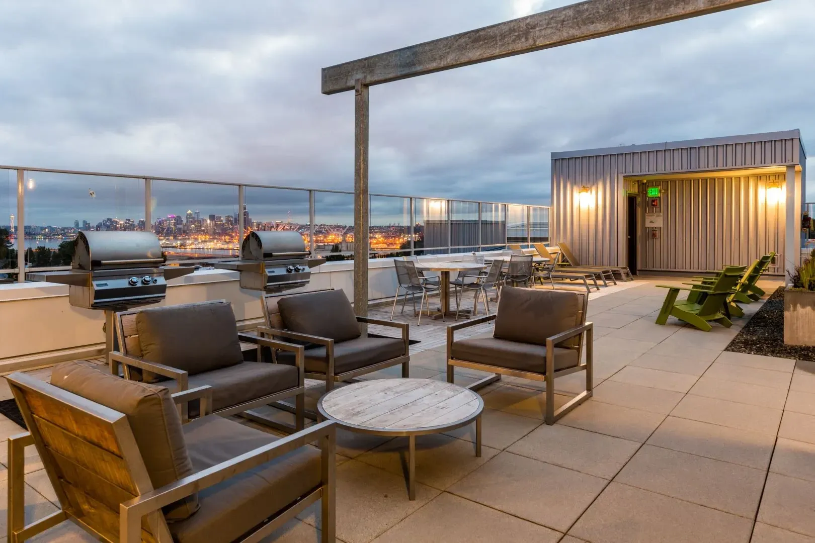 Rooftop lounge area with grills and city views