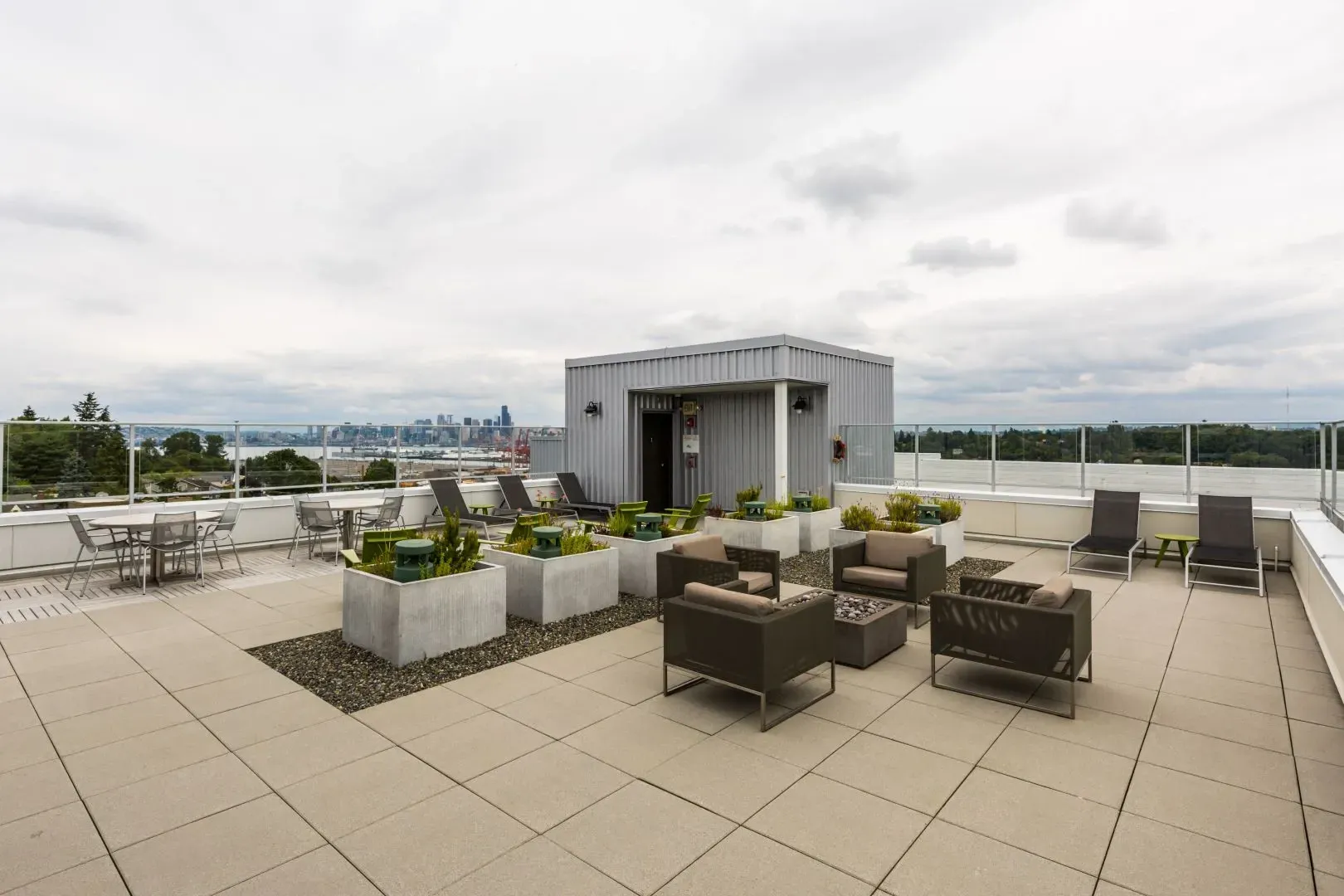 Rooftop lounge area with seating and city views.