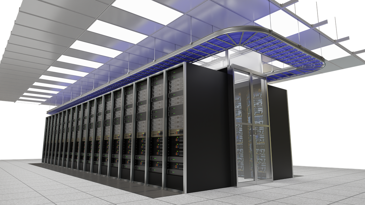 A row of black server cabinets arranged in a contained aisle with blue overhead cooling infrastructure in a data center.