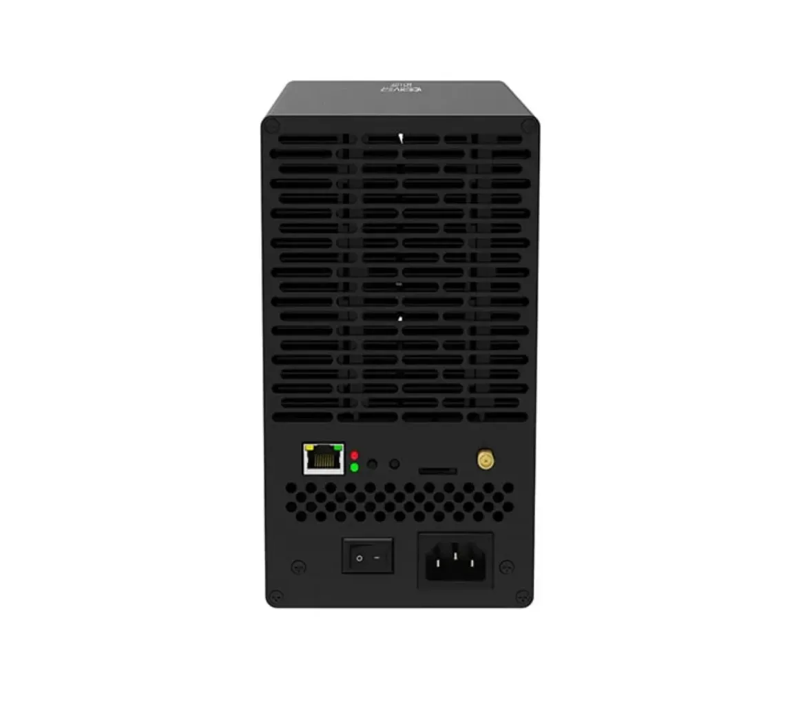 The back of a black box with a power cord plugged into it.