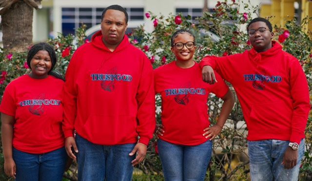 A group of people wearing red shirts with the word hurricane on them