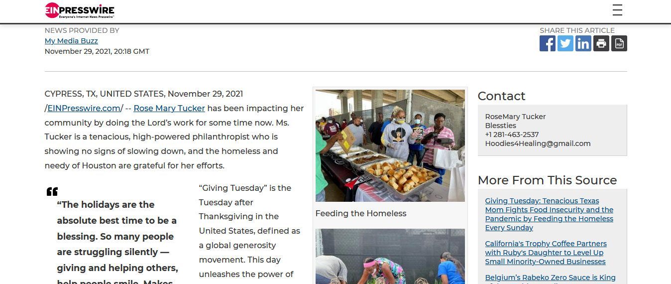 A newspaper with a picture of a group of people standing around a table.