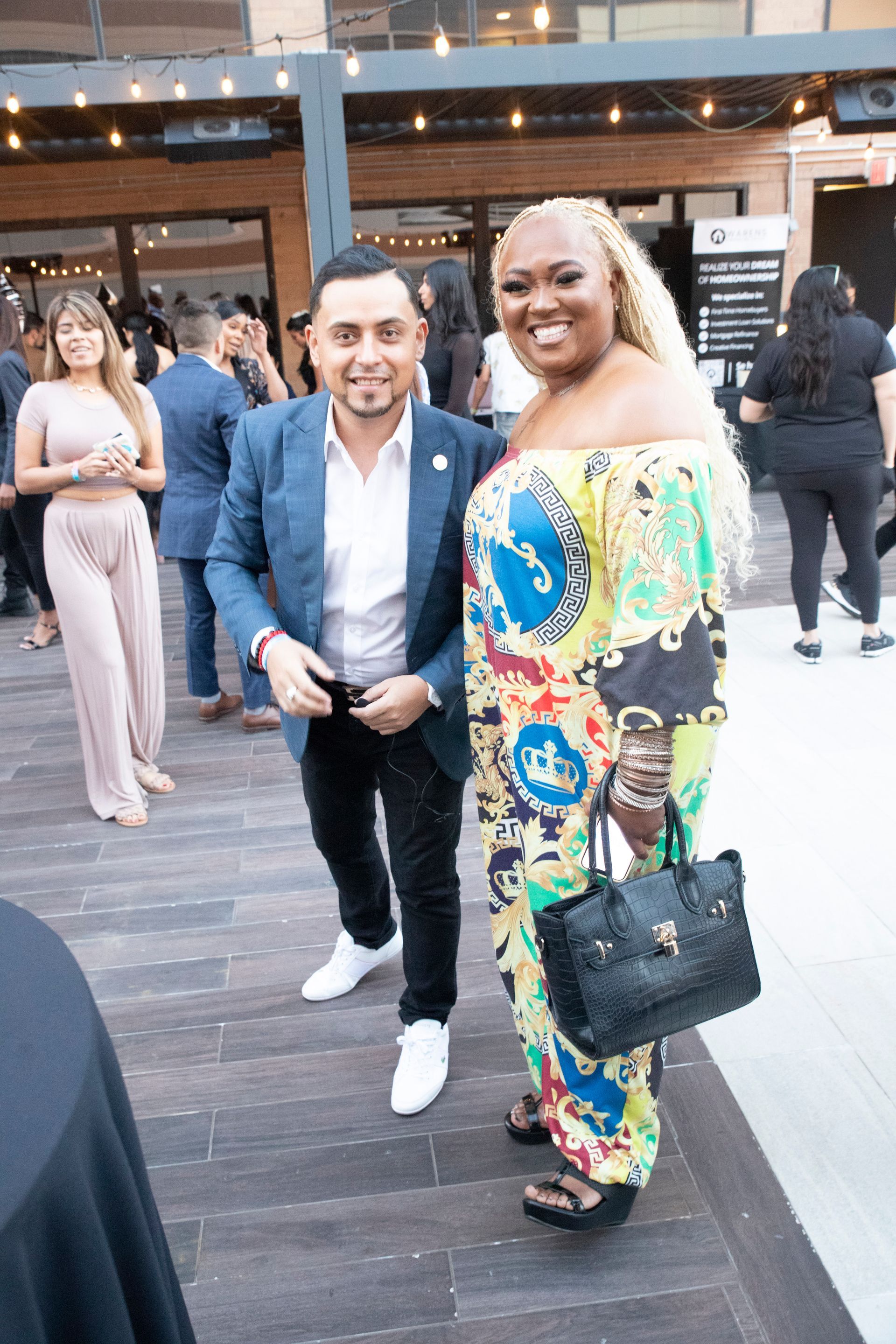 A man and a woman are standing next to each other on a wooden floor.