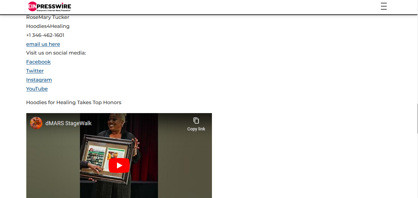 A screenshot of a website with a video of a woman holding a picture.
