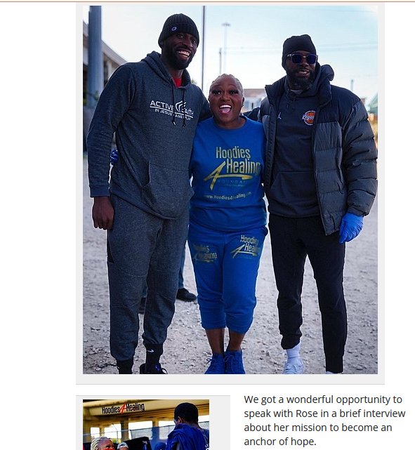 Three people posing for a picture with one wearing a shirt that says health