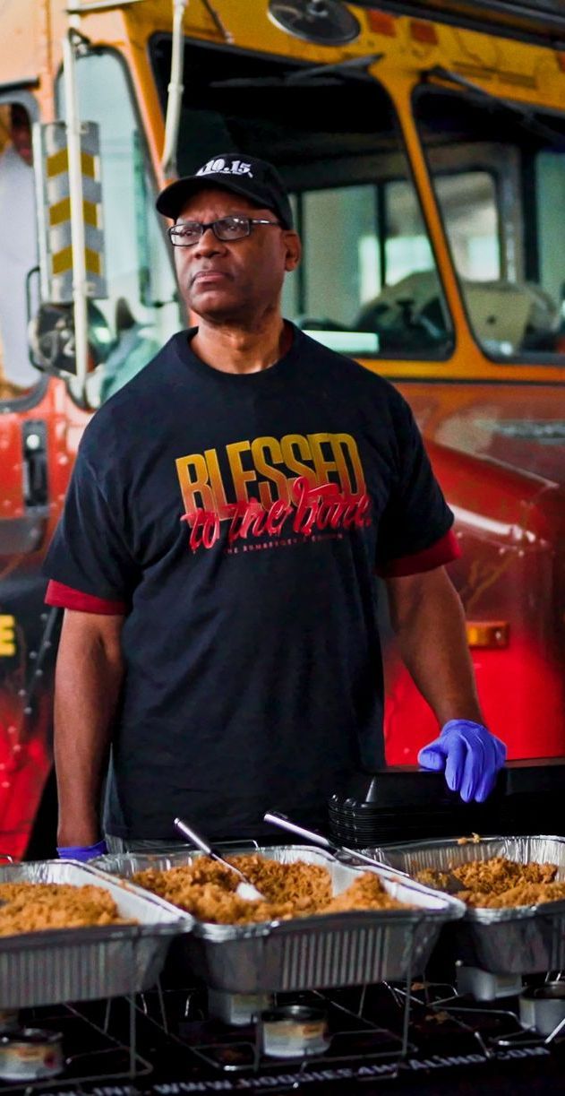 A man wearing a red shirt that says ' miami ' on it
