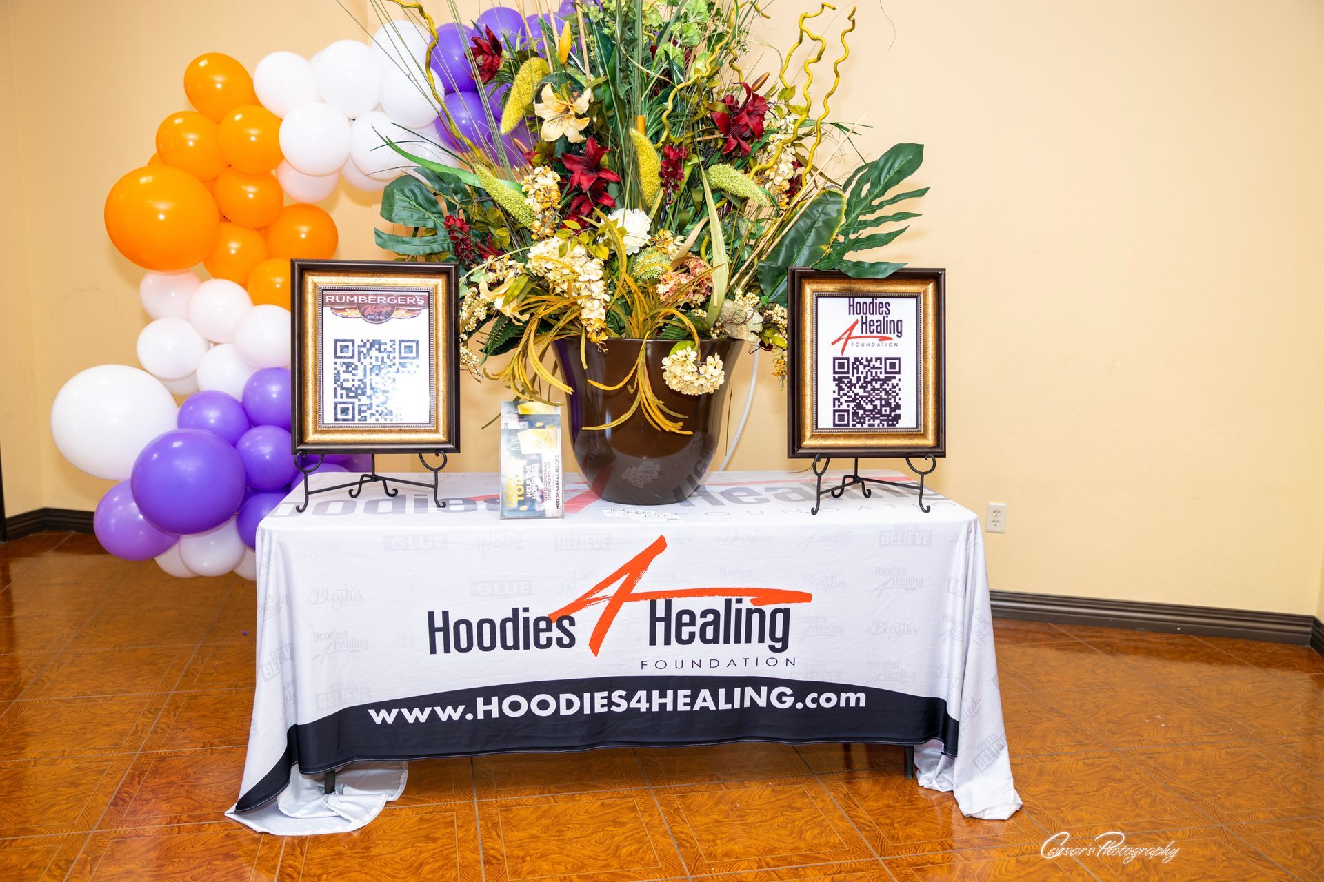 A table with a sign that says hoodies healing on it