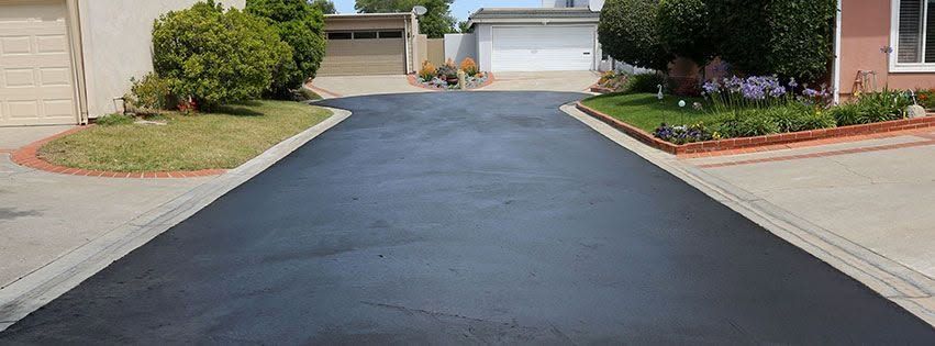 New asphalt driveway installation at a residential property in Bucks County, PA