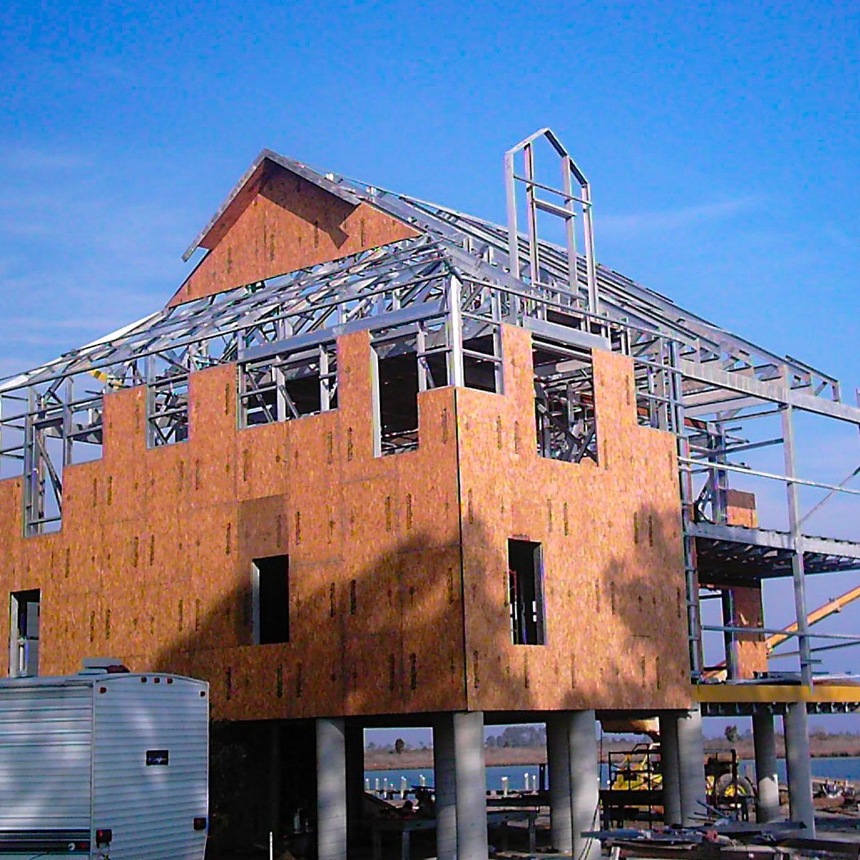 a building under construction with a blue sky in the background
