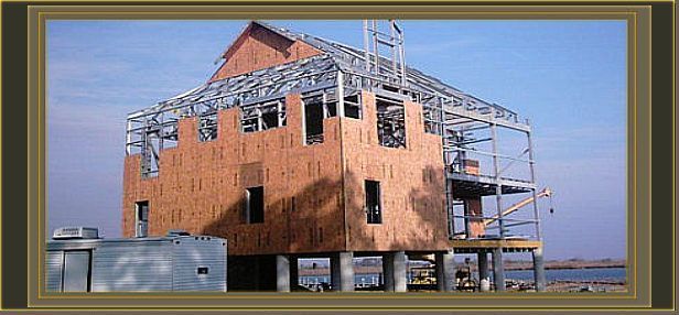 a picture of a house under construction with a metal frame