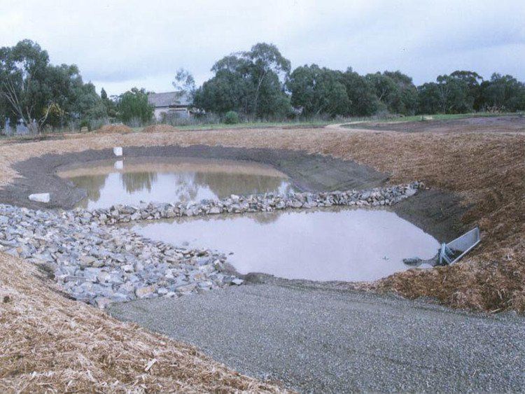 Strath Hub Large Body of Water Surrounded by Rocks & Dirt — Victor Harbor, SA — South Coast Sand & Civil