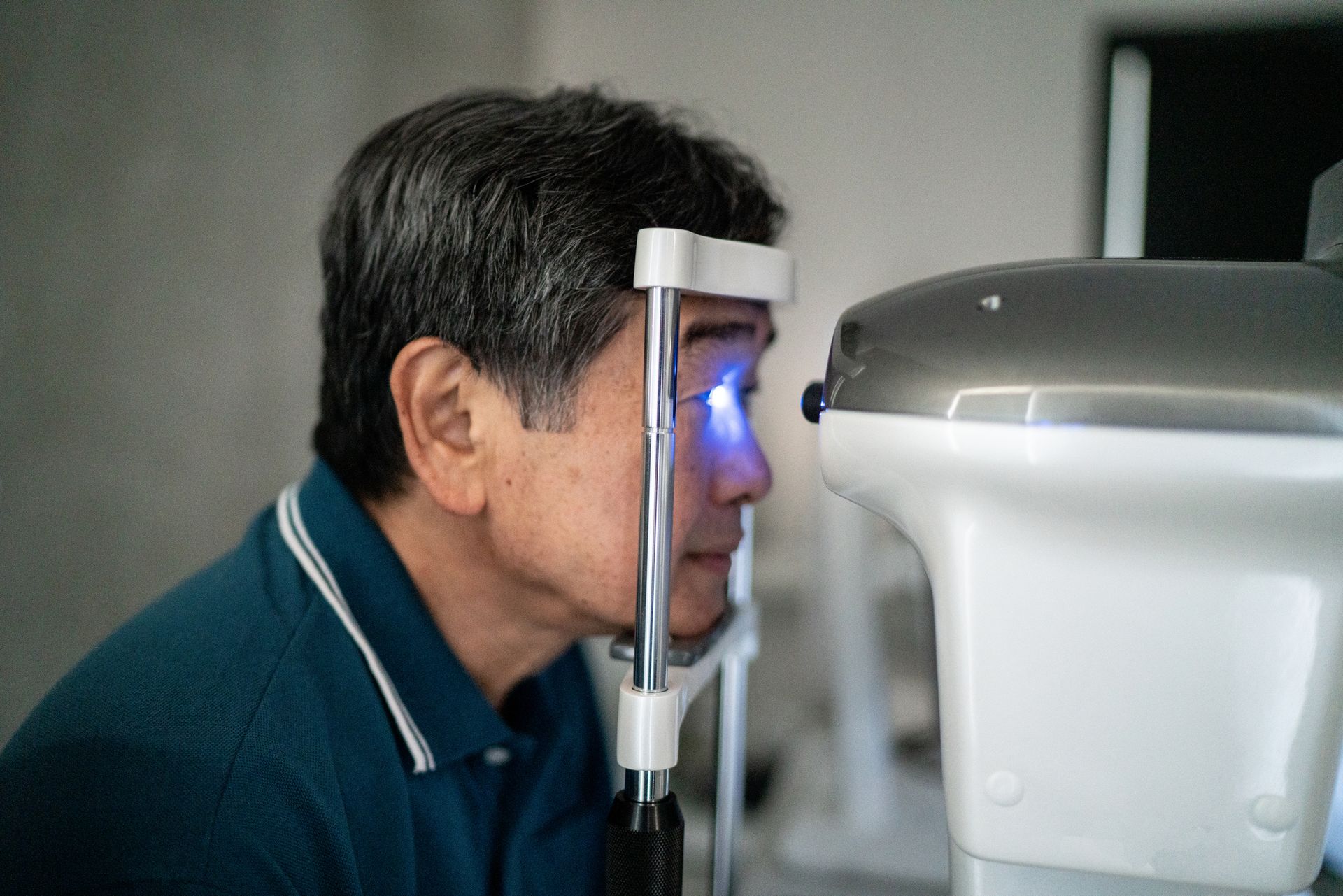 A woman is getting her eyes checked by an ophthalmologist.