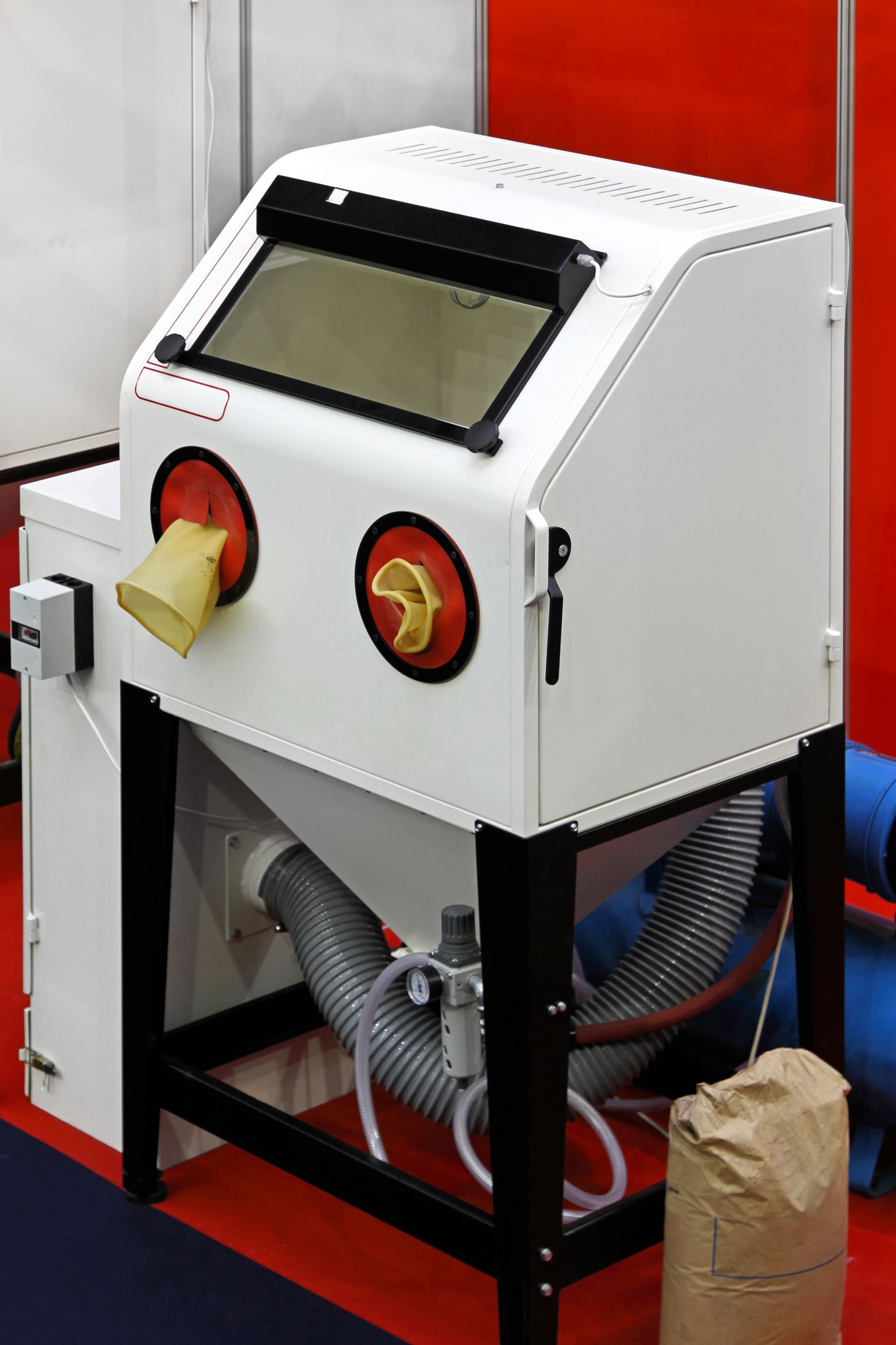 Sand blasting cabinet in metal work shop.