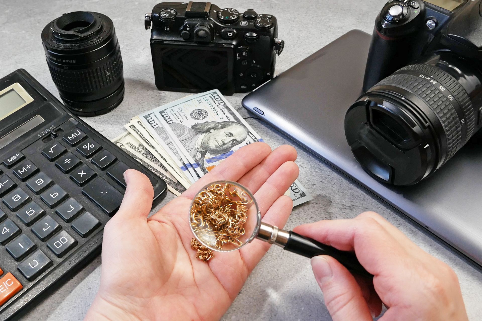 A person is holding a magnifying glass in their hand.