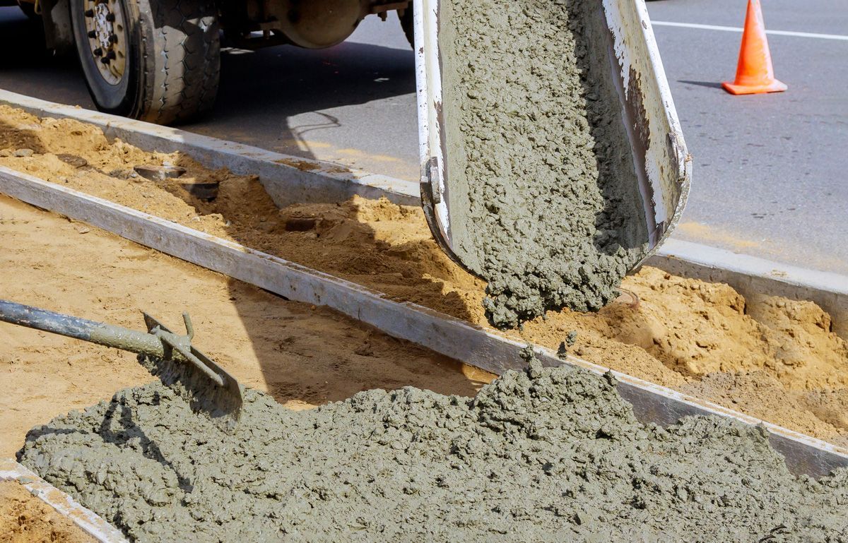Concrete Being Poured Out of a Cement Truck — Mayfield, NY — Miller's Ready Mix Concrete