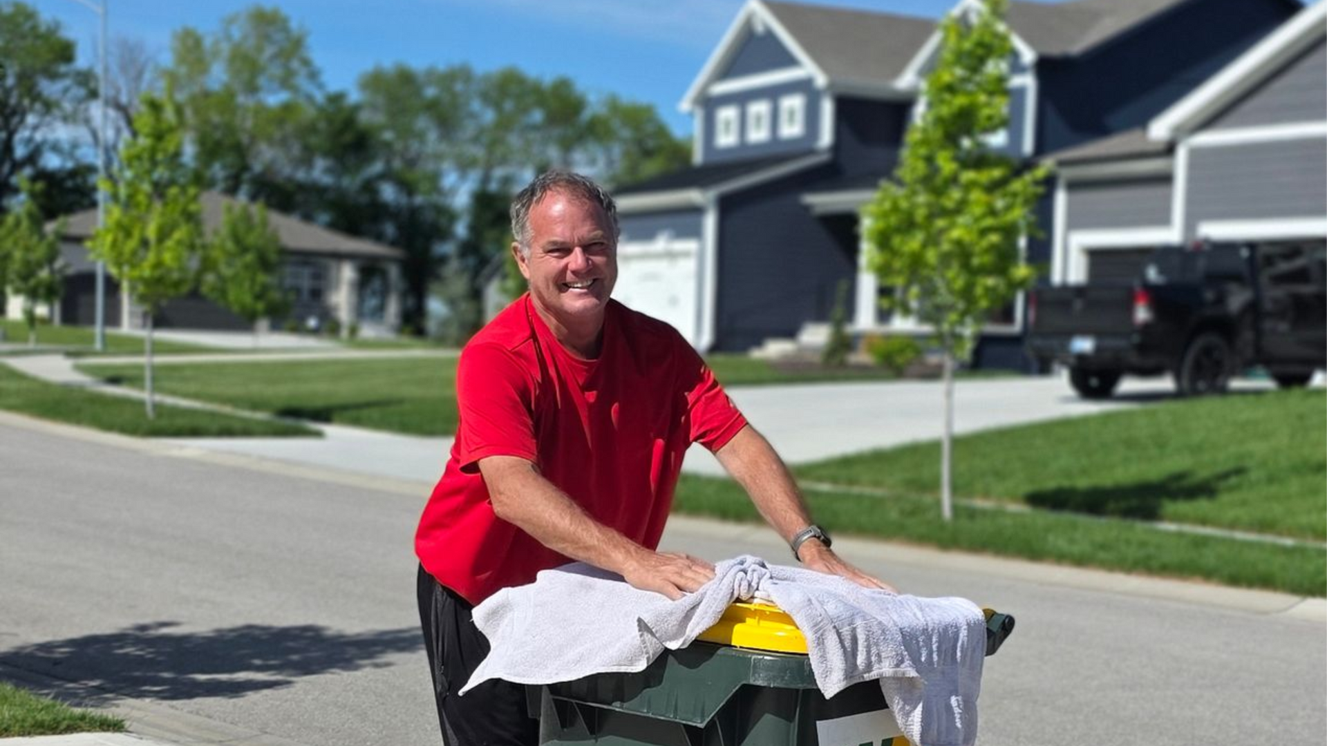 Phil applying deodorizer treatment to a freshly cleaned bin