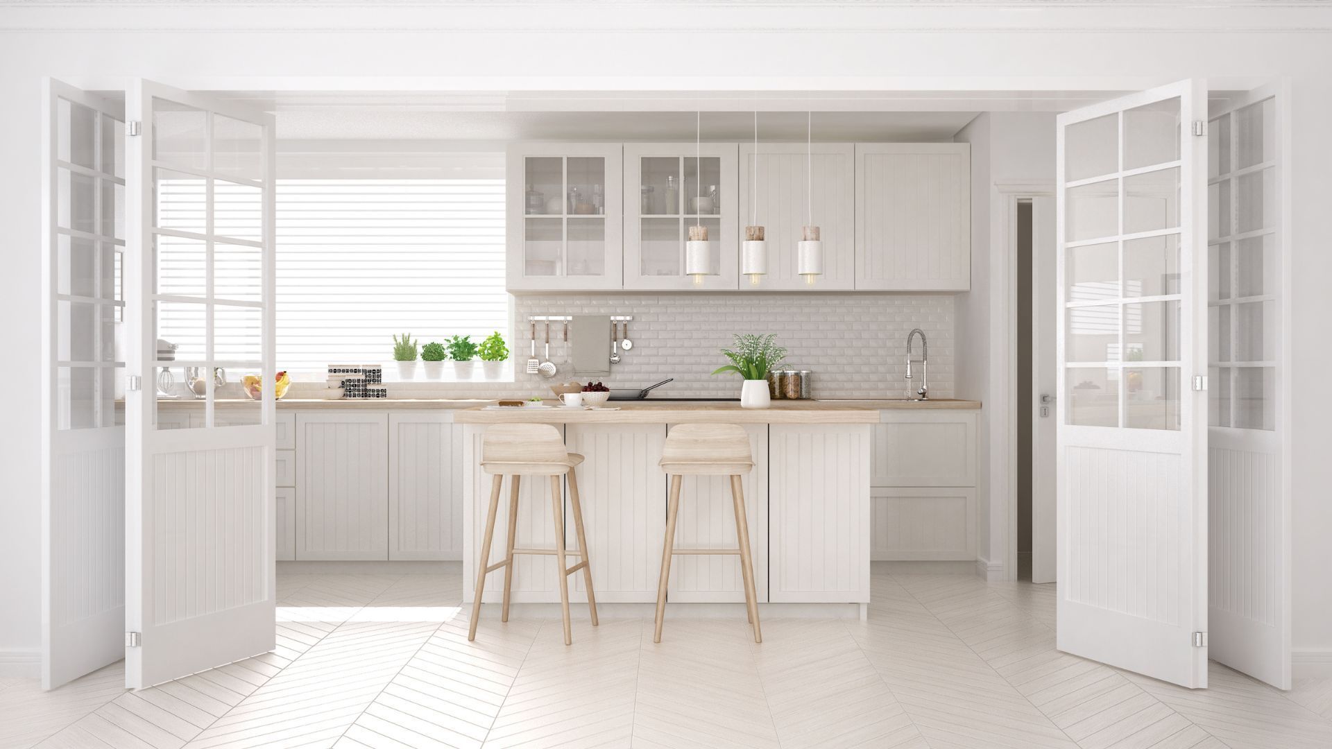 A modern kitchen with white cabinets , wooden counter tops , and stools.