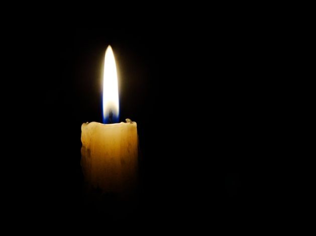 Lit candle symbolizes remembrance during cremation services in North Port, FL, honoring loved ones.