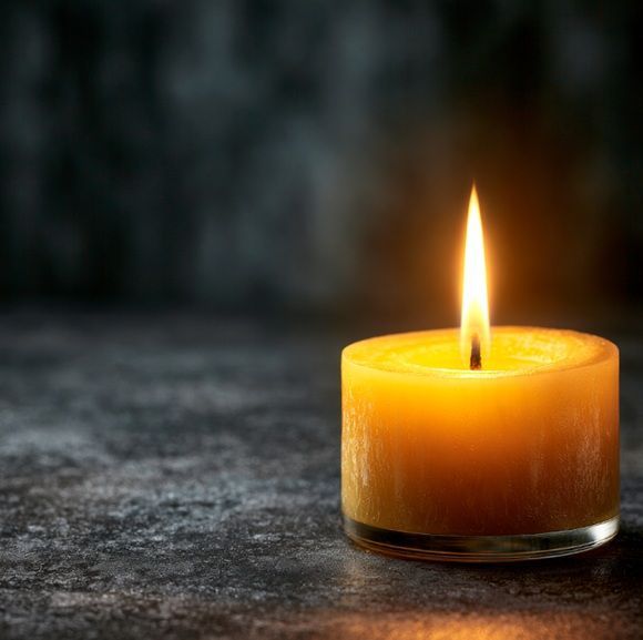 Lit memorial candle symbolizes Port Charlotte, FL cremation services with remembrance.