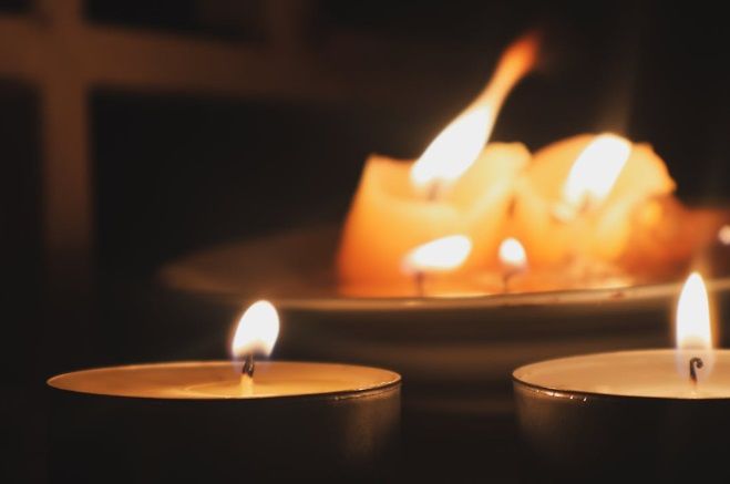 Lit memorial candles create peaceful funeral remembrance setting in North Port, FL.
