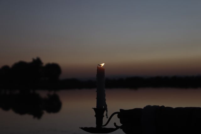 Candlelight memorial during a sunset celebration of life service at a Port Charlotte, FL funeral home and cremations provider.