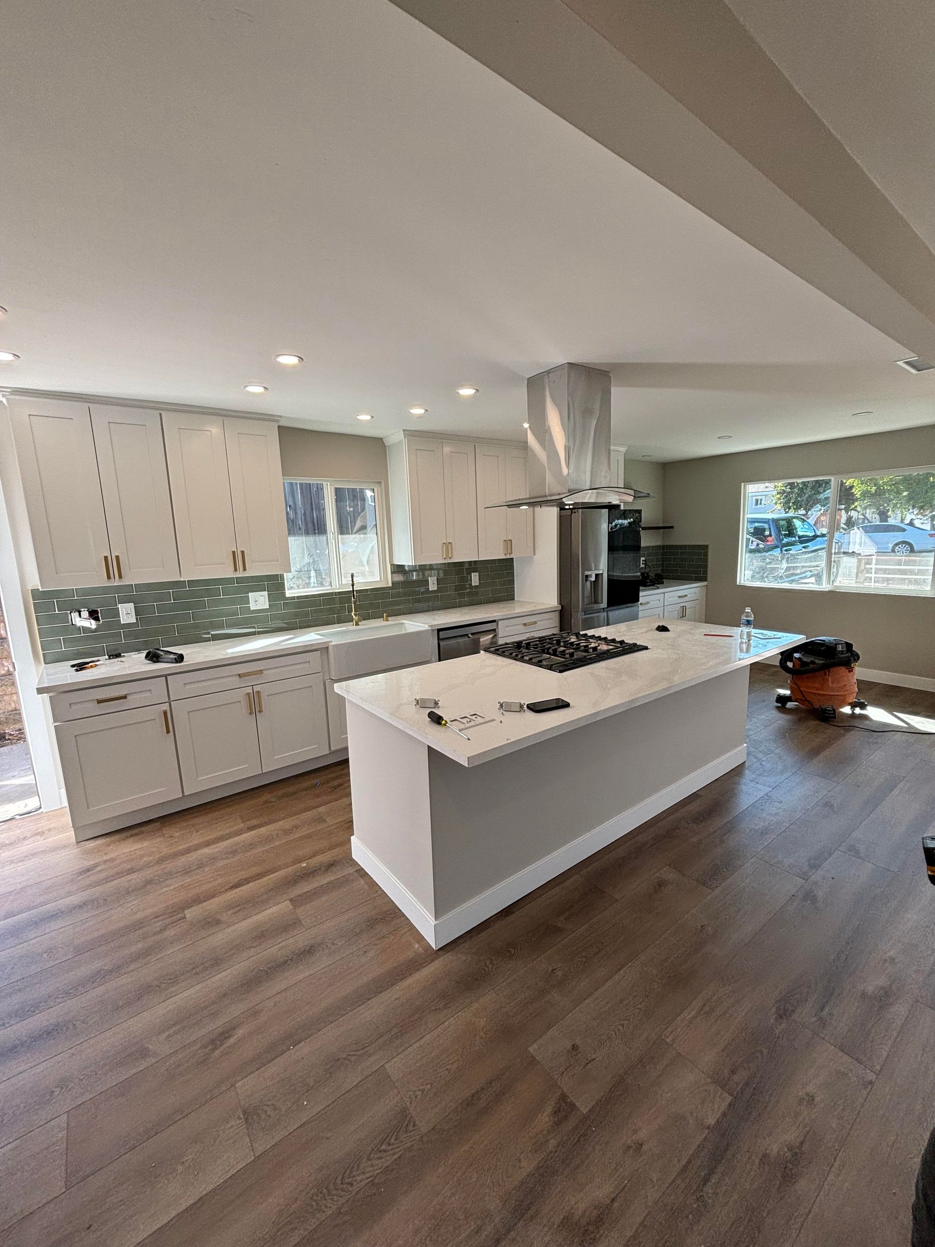 There is a large island in the middle of the kitchen.