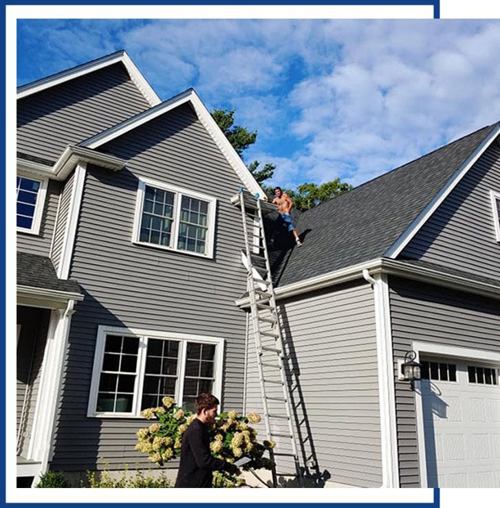 Man At Top Of Roof — Raynham, MA — JDM Siding And Windows